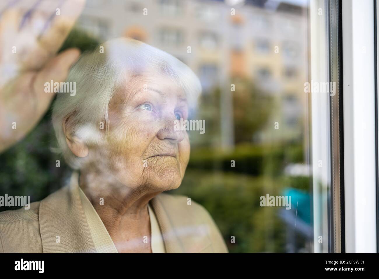 Portrait of an elderly woman in a state of worry at home Stock Photo