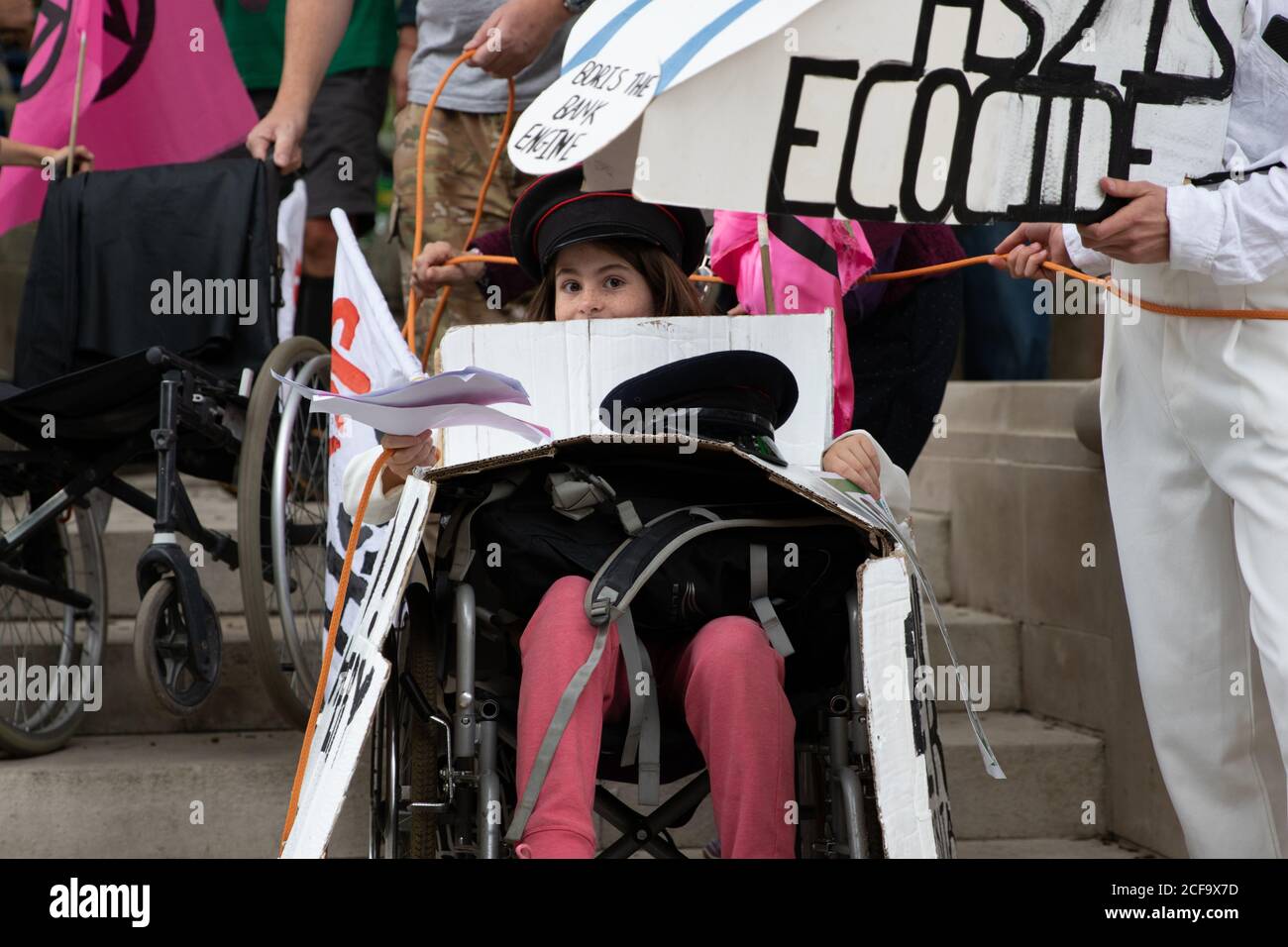 London, UK. 4th September, 2020. A girl in a wheelchair leads the anti-hs2 trains at day five of Extinction Rebellion’s 10 day protest. Protests are occurring internationally. Protest’s in England are focussed on getting MPs to back the Climate and Ecological Emergency Bill and against HS2. Credit: Liam Asman/Alamy Live News Stock Photo