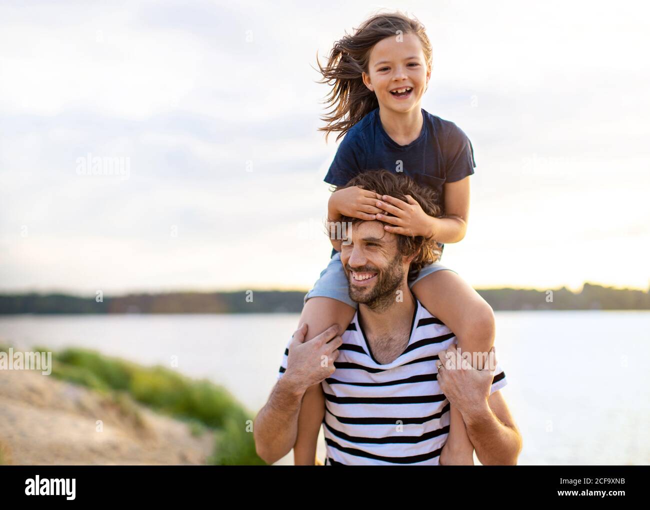Father with a child spending the day at the beach Stock Photo