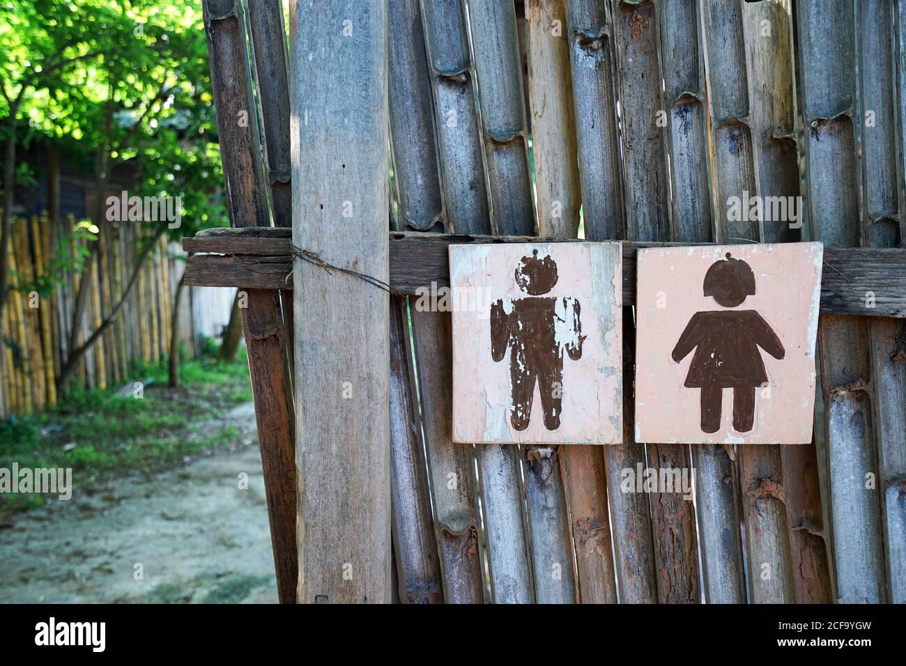 Close up wooden Kids signboard in front of public restroom Stock Photo