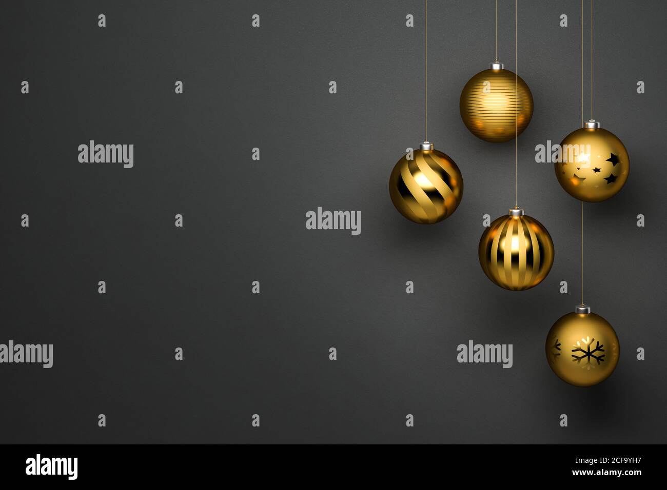 Golden Christmas Baubles with different designs hanging in front of a ...