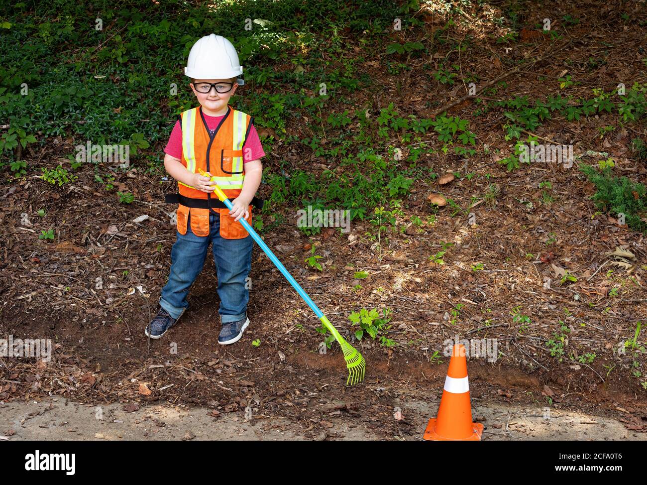 Young boy dressed for his role as a construction worker. Stock Photo