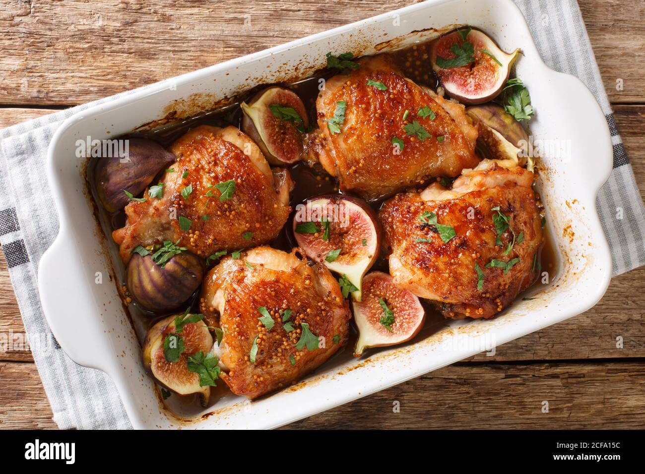 Honey Chicken Thighs Baked With Ripe Figs Mustard And Herbs Close Up In A Baking Dish On The Table Horizontal Top View From Above Stock Photo Alamy