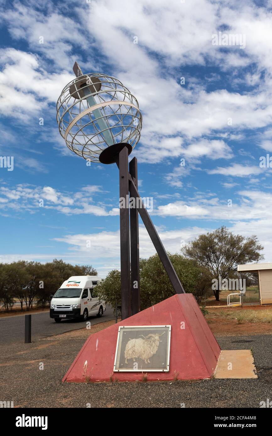 Rental van at the Tropic of Capricorn. Sculpture of Earth globe. Marker placed at this latitude. Camping allowed. Stuart highway, Alice Springs, North Stock Photo