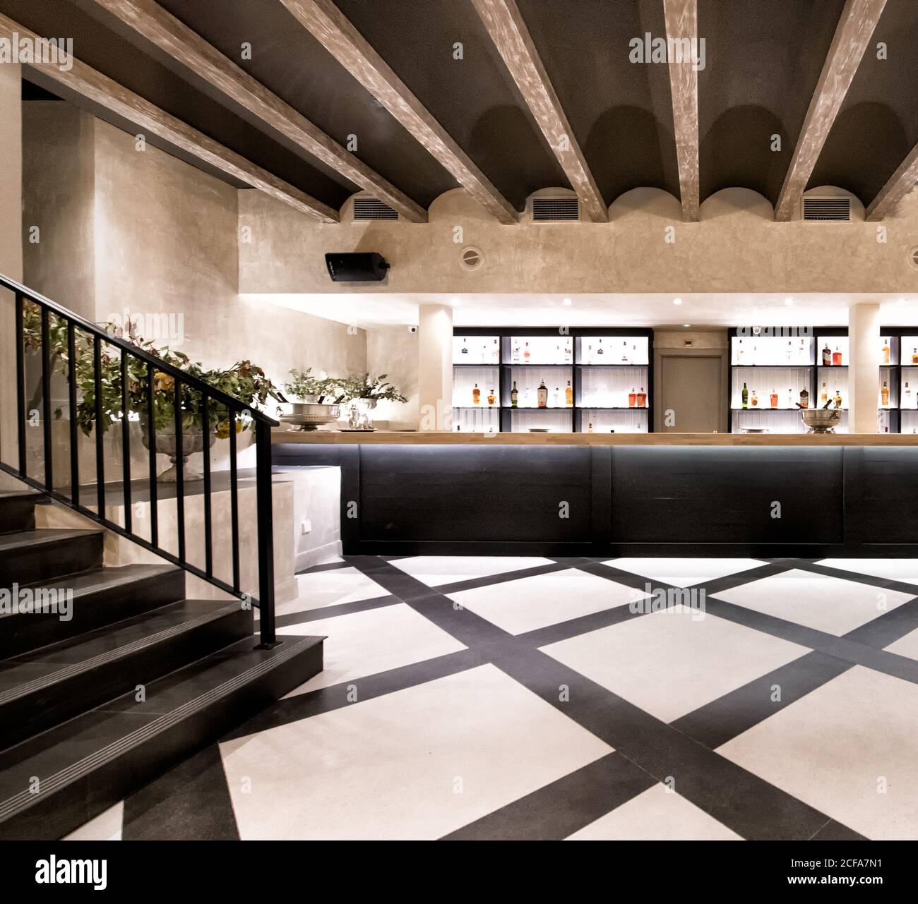 Interior of hallway with bar of contemporary building with geometric design in black and gray colors with loft elements Stock Photo