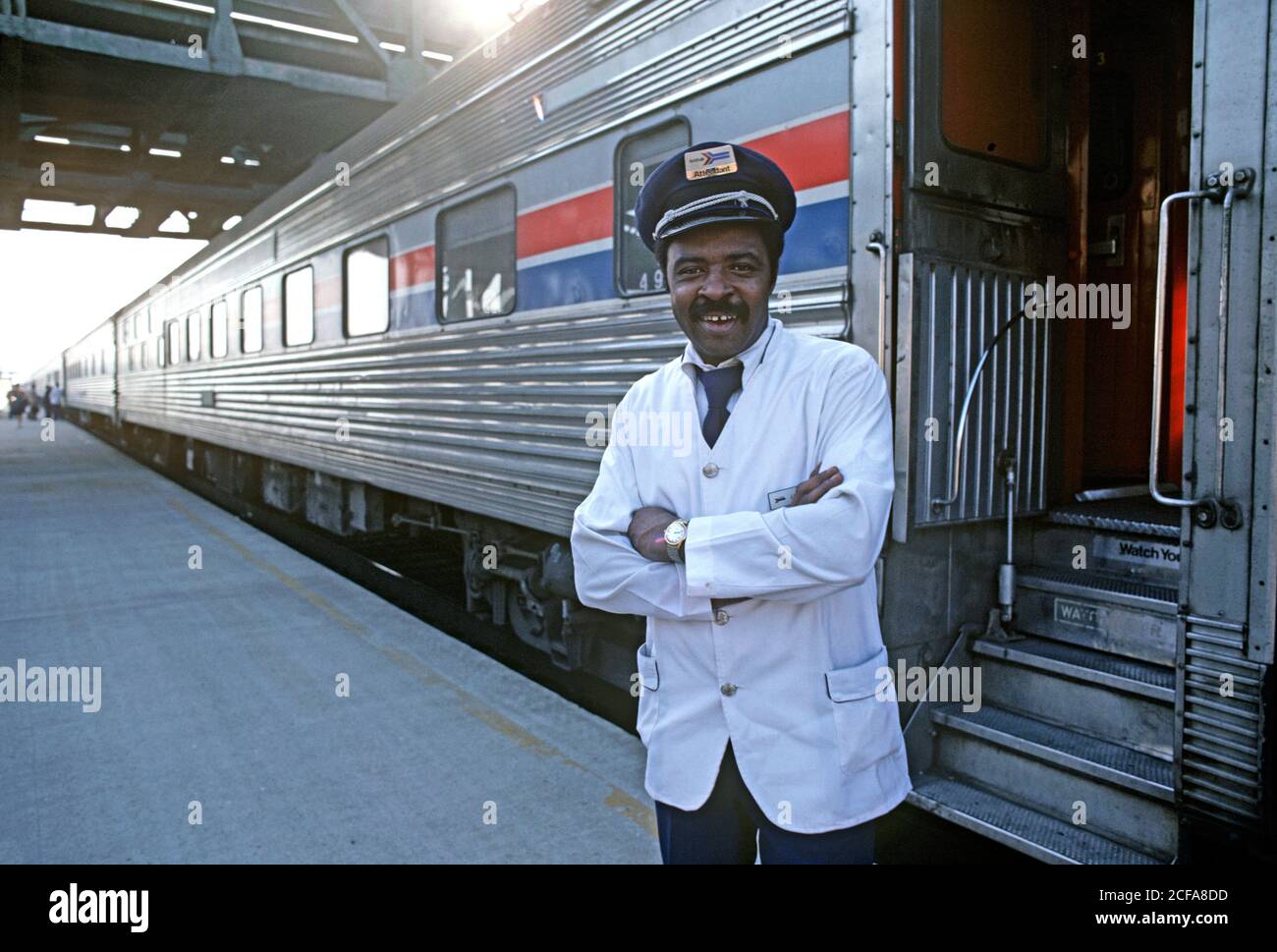 AMTRAK TRAIN ATTENDANT IN RAILWAY STATION, USA, 1970s Stock Photo