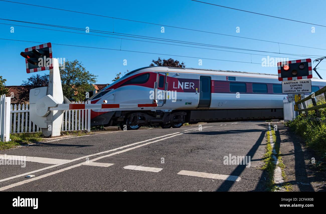 Lner Azuma Train On East Coast Mainline Railway Line Level Crossing With Flashing Lights Markle East Lothian Scotland Uk Stock Photo Alamy