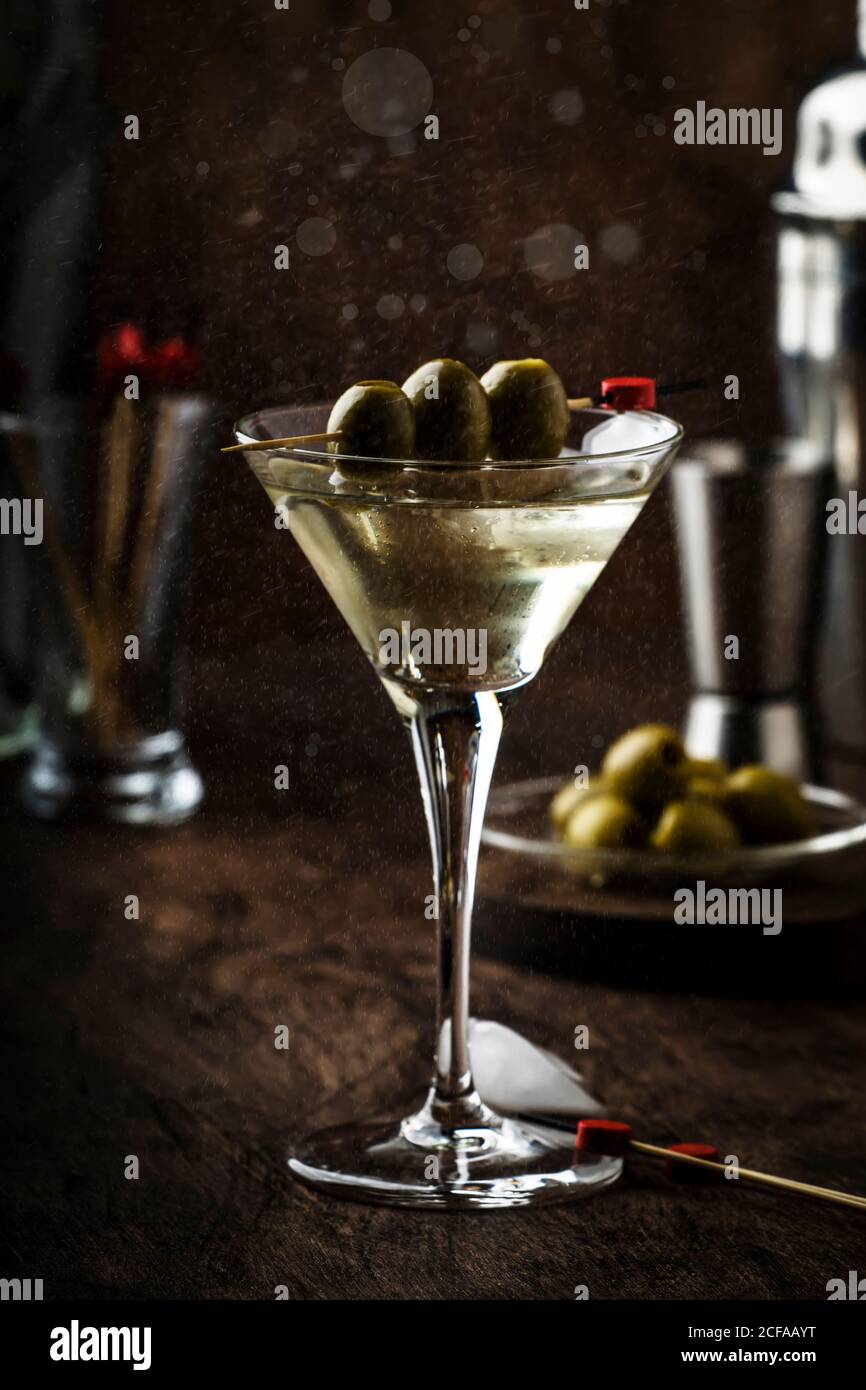 Martini vodka cocktail, with dry vermouth, vodka and green olives, bar