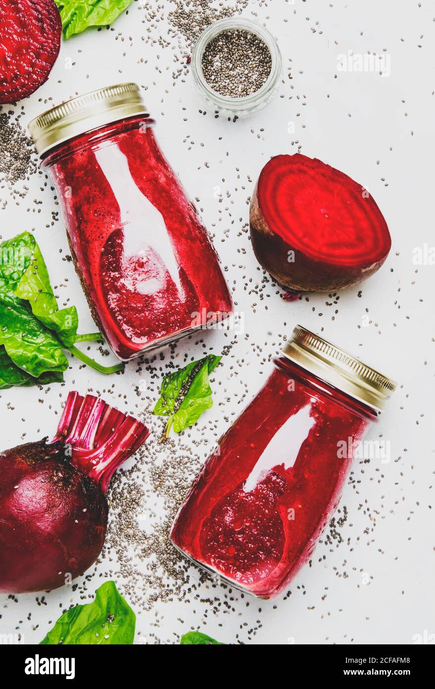 Delicious beetroot smoothies in glass bottles with chia on white food ...