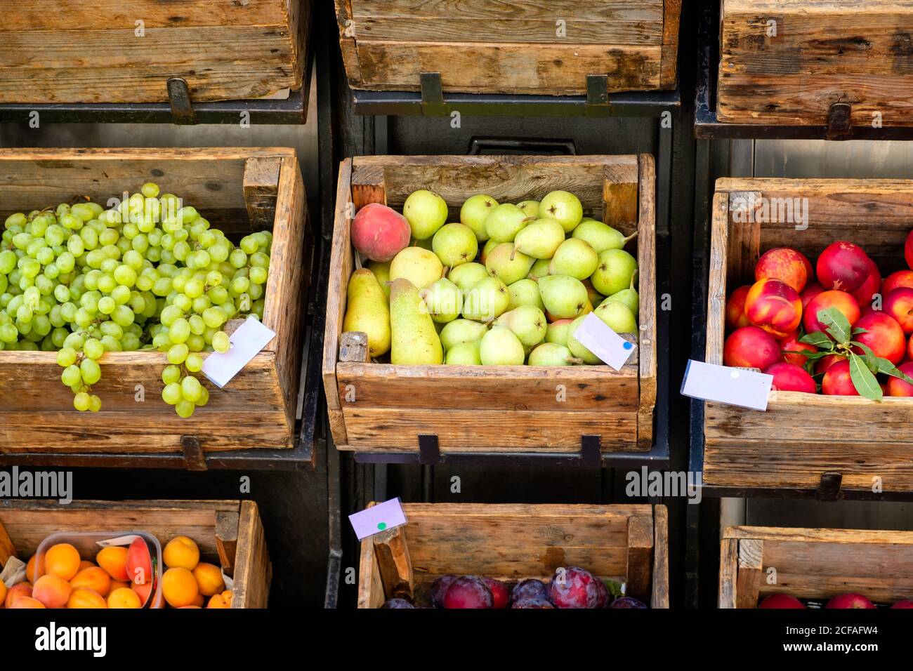 Fruits on rustic wooden boxes for sale on a street market Stock Photo