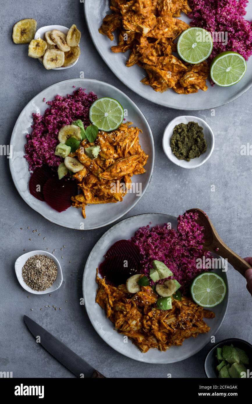 Plates with red quinoa and chicken curry Stock Photo