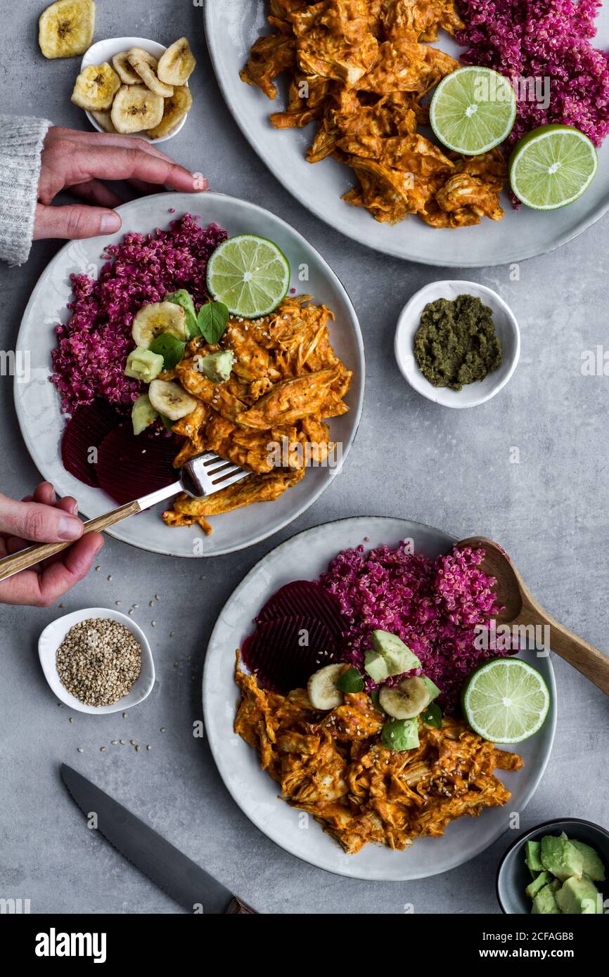 Plates with red quinoa and chicken curry Stock Photo