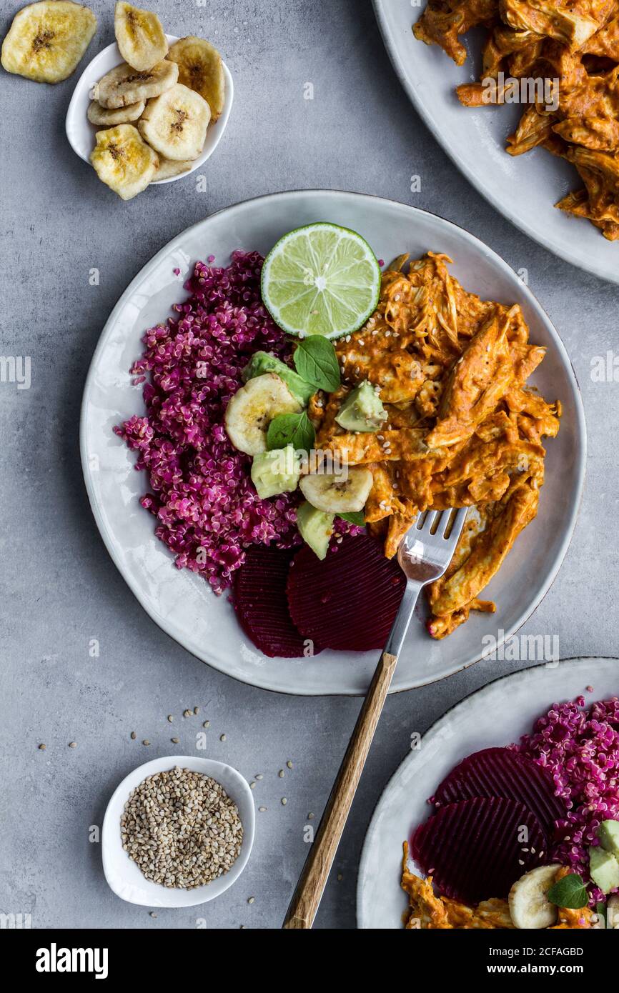 Plates with red quinoa and chicken curry Stock Photo
