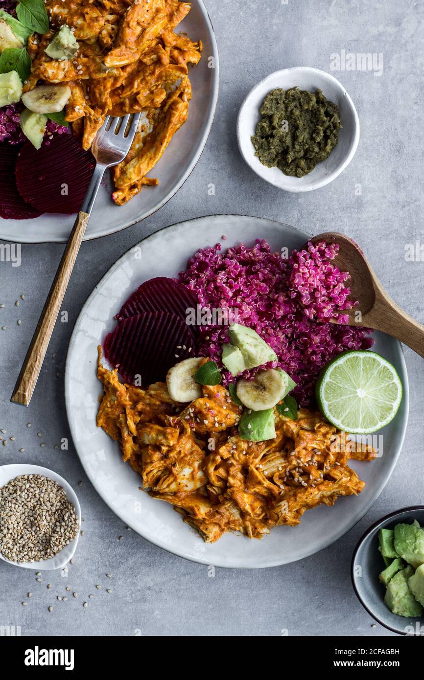 Plates with red quinoa and chicken curry Stock Photo