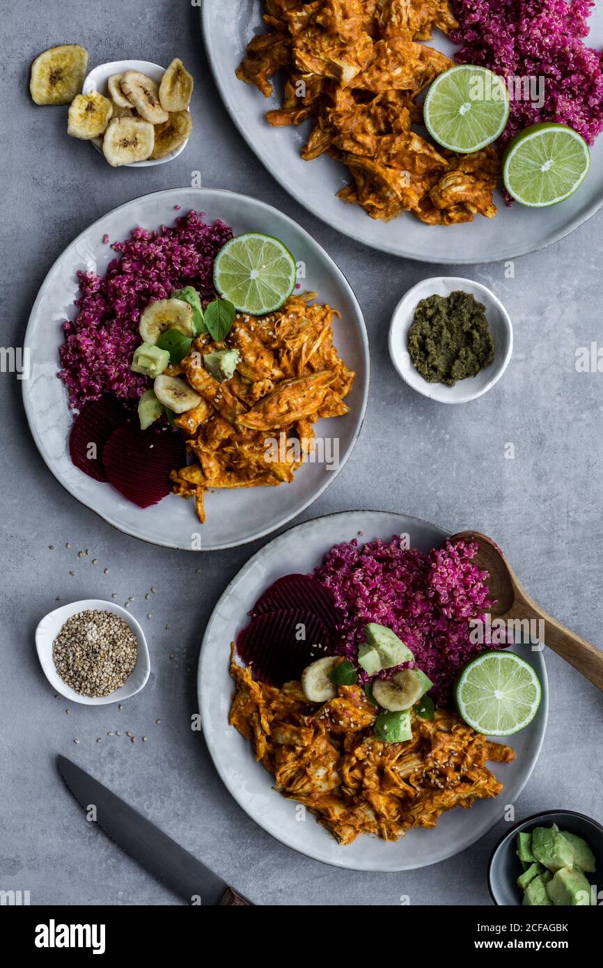 Plates with red quinoa and chicken curry Stock Photo