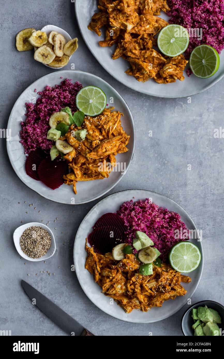 Plates with red quinoa and chicken curry Stock Photo