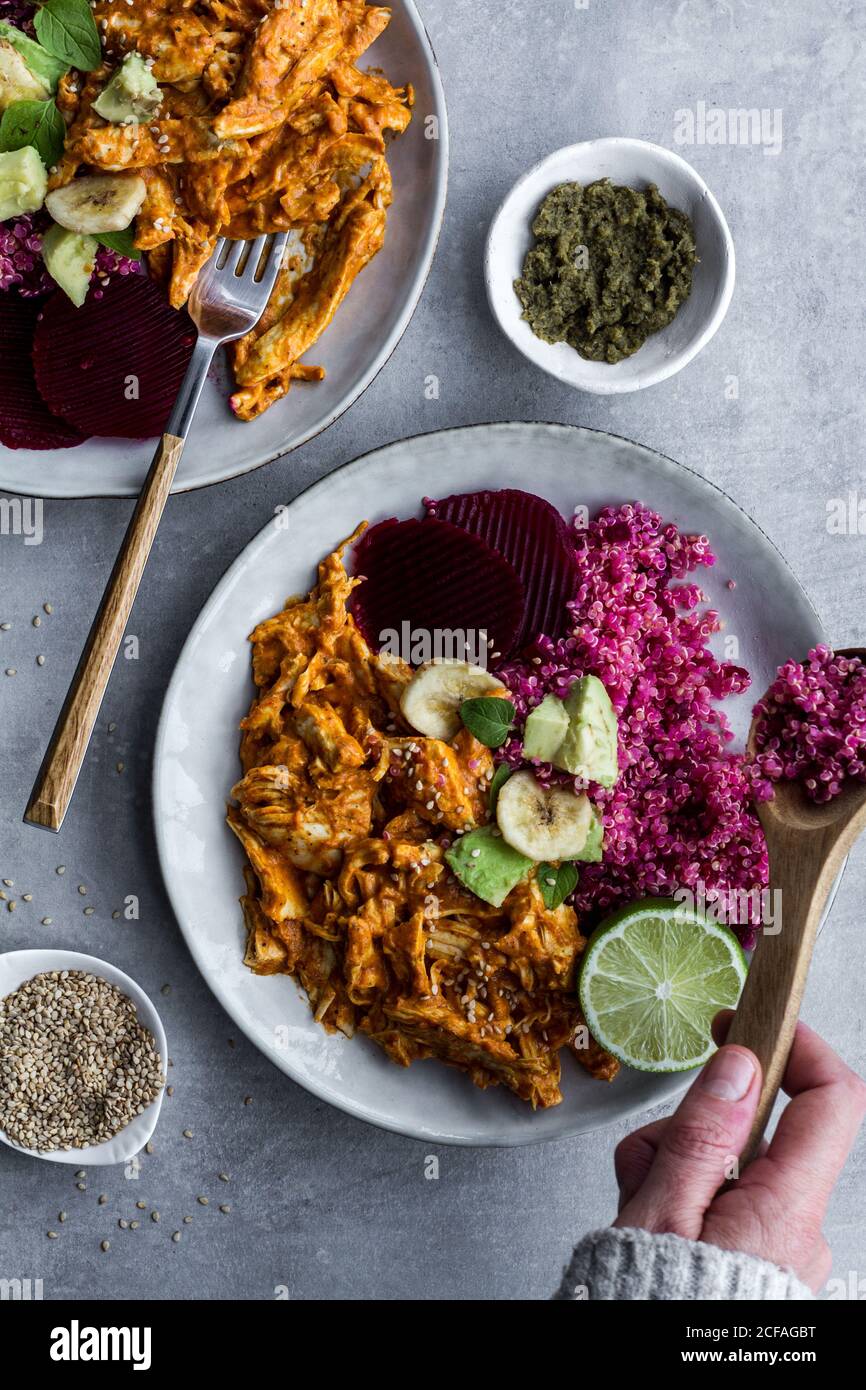 Plates with red quinoa and chicken curry Stock Photo