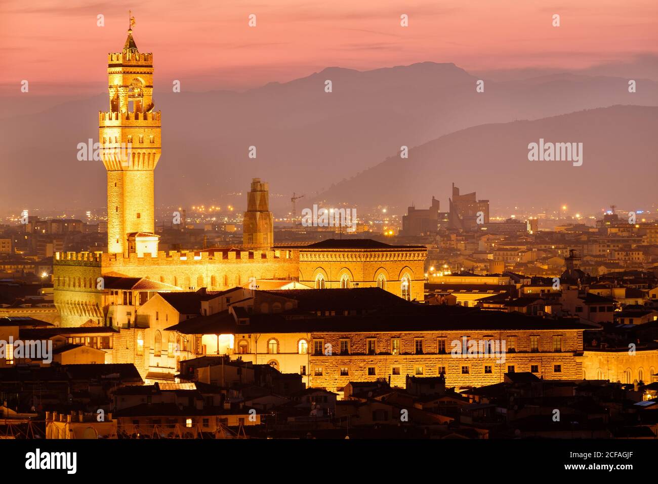 The Palazzo Vecchio and the historic centre of Florence illuminated at sunset Stock Photo