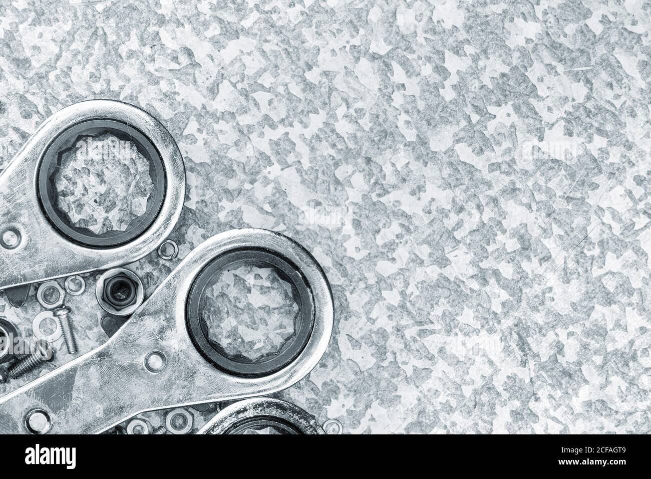 Wrench tools ratchets on a light metallic textured background Stock Photo
