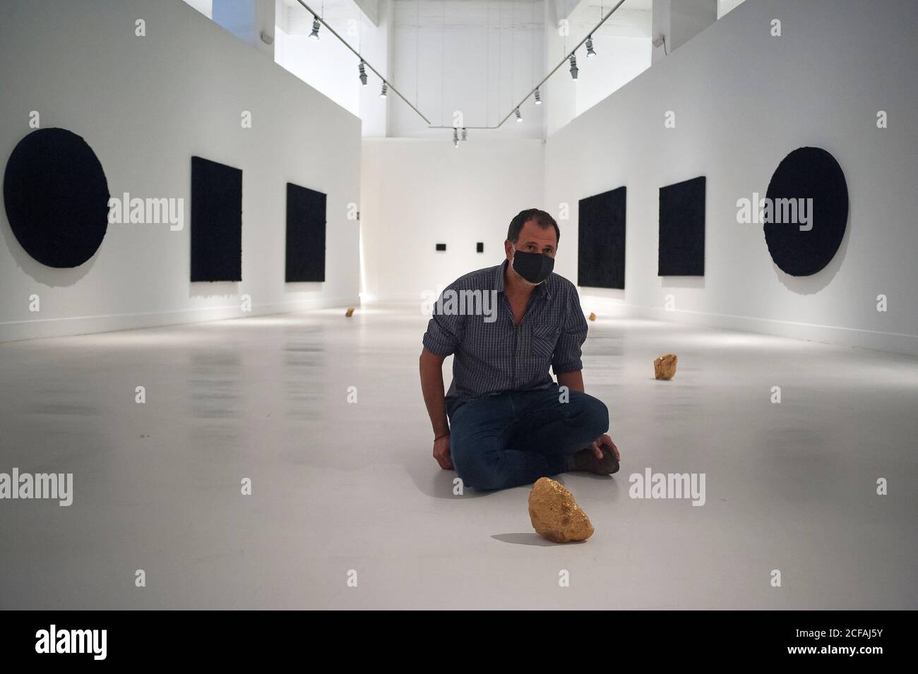 Malaga, Spain. 04th Sep, 2020. Mexican artist, Bosco Sodi poses for the media during the exhibition 'Ergo Sum' at Contemporary Art Centre.Mexican artist, Bosco Sodi arrives with around 40 works such as black monochromatic paintings in different formats and gold sculptures. The artist is known for his use of raw, natural materials to create large-scale textured paintings and objects. The exhibition will run in Malaga from 04 September to 06 December 2020. Credit: SOPA Images Limited/Alamy Live News Stock Photo