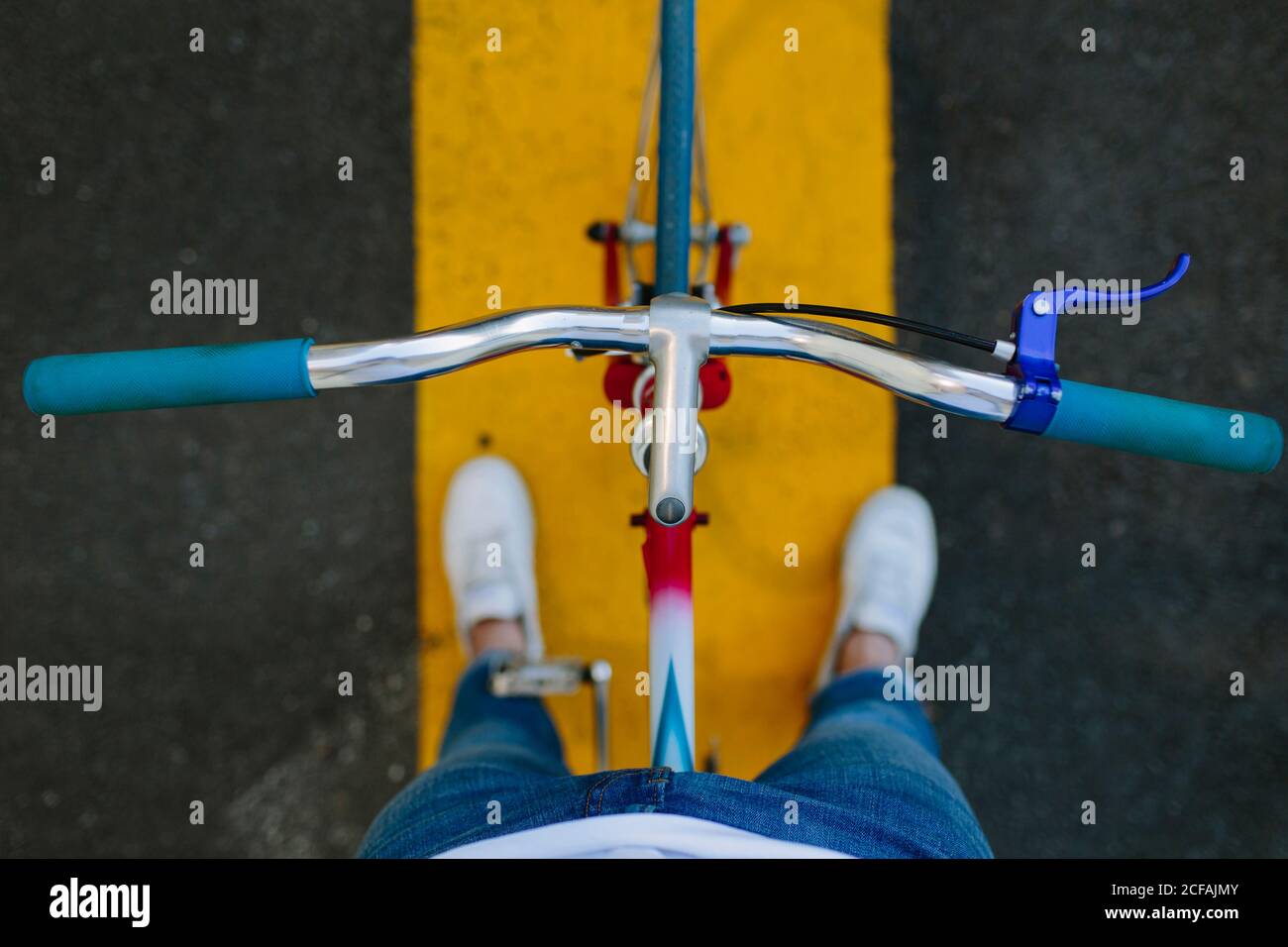 Top view of a fixie bike's handlebar over a crosswalk Stock Photo