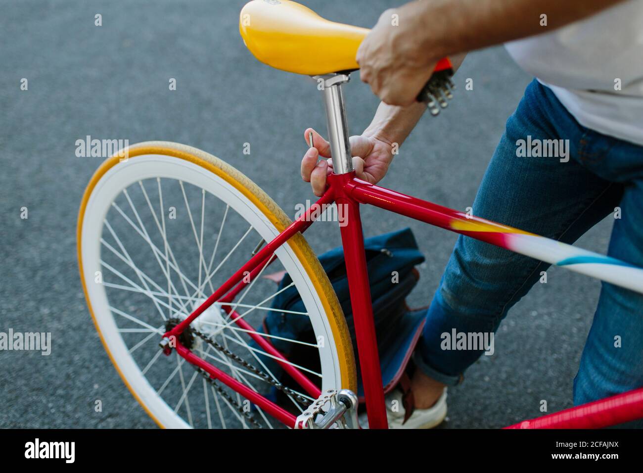 Close-up view of a man setting up his bike for riding. Stock Photo