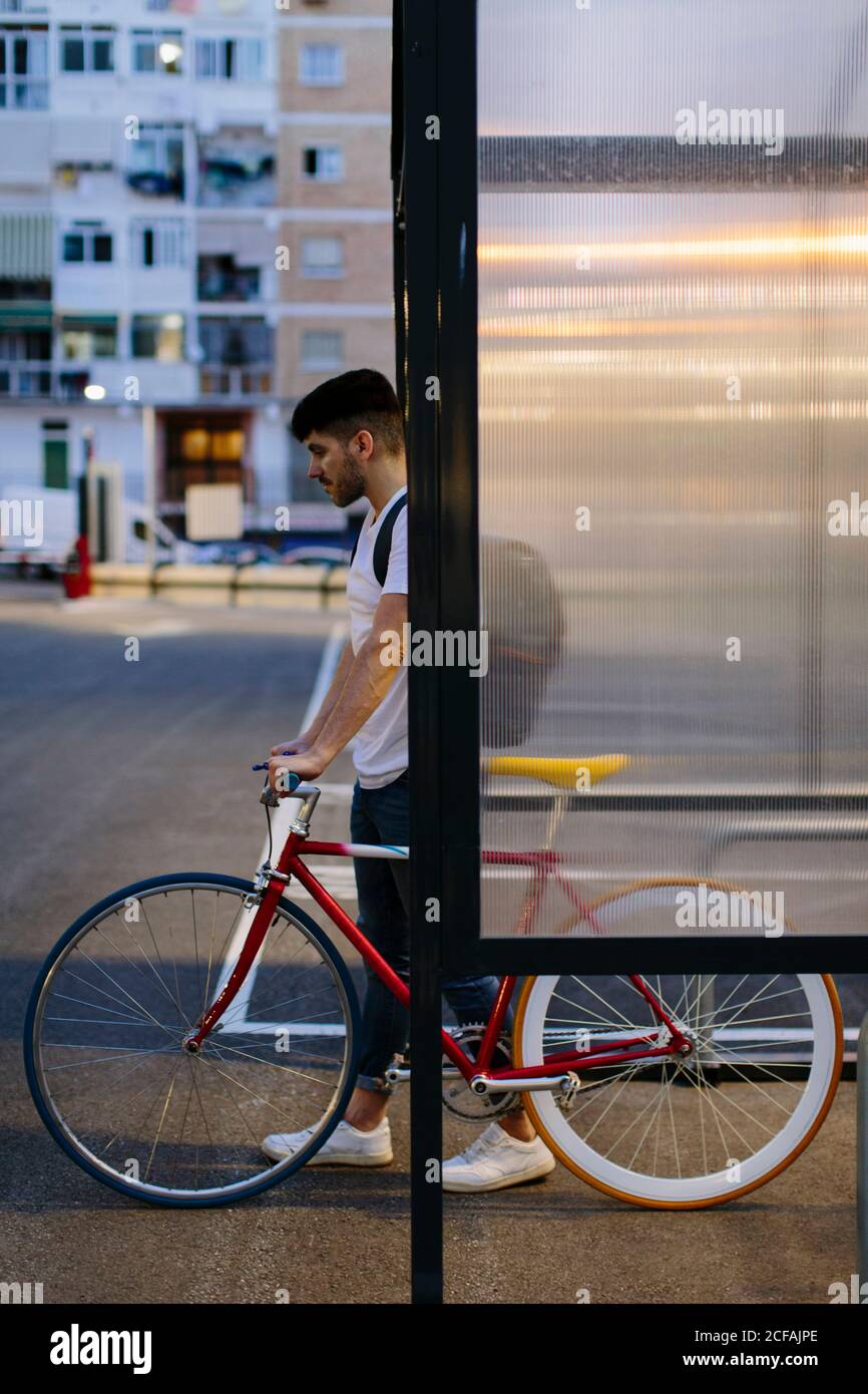 Young man getting out of a parking with a fixie bike Stock Photo