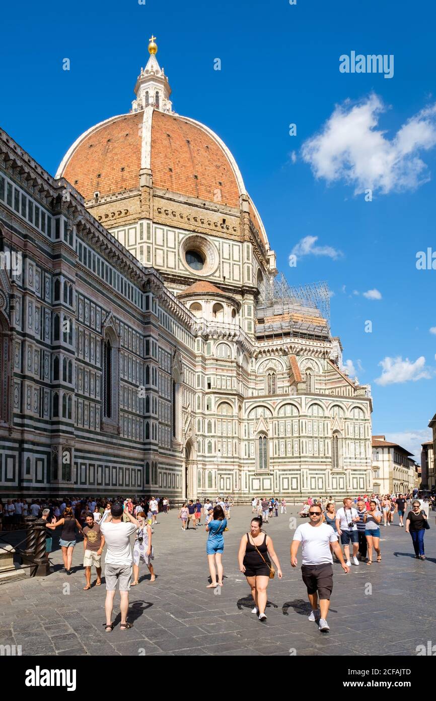 FLORENCE,ITALY - JULY 24,2017 : Tourists and locals at Piazza del Duomo with a view of the Cathedral of Florence Stock Photo