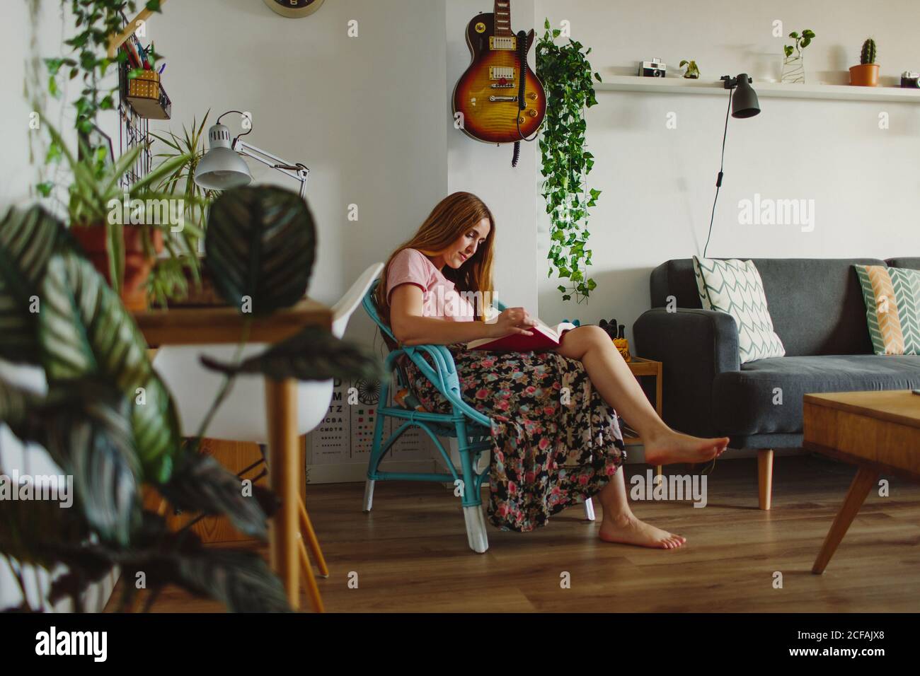 Sitting in chair barefoot hi-res stock photography and images - Alamy