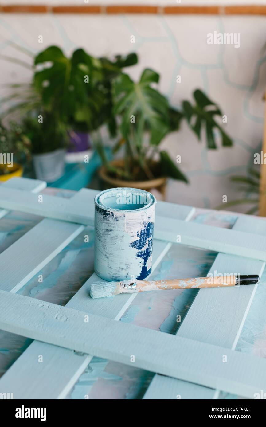 Close-up view of a brush and a paint pot when the restoration has finished. Stock Photo