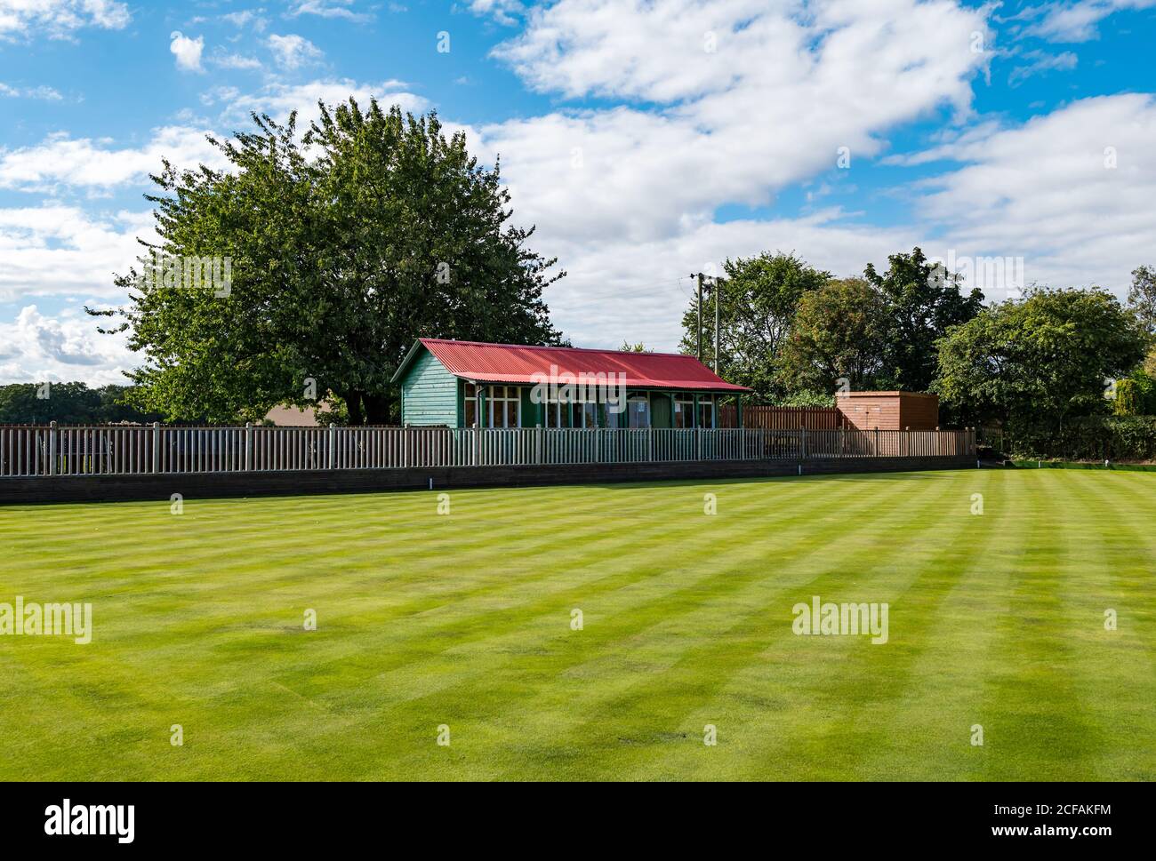 Village bowling green with hut on sunny day, Athelstaneford, East Lothian, Scotland, UK Stock Photo