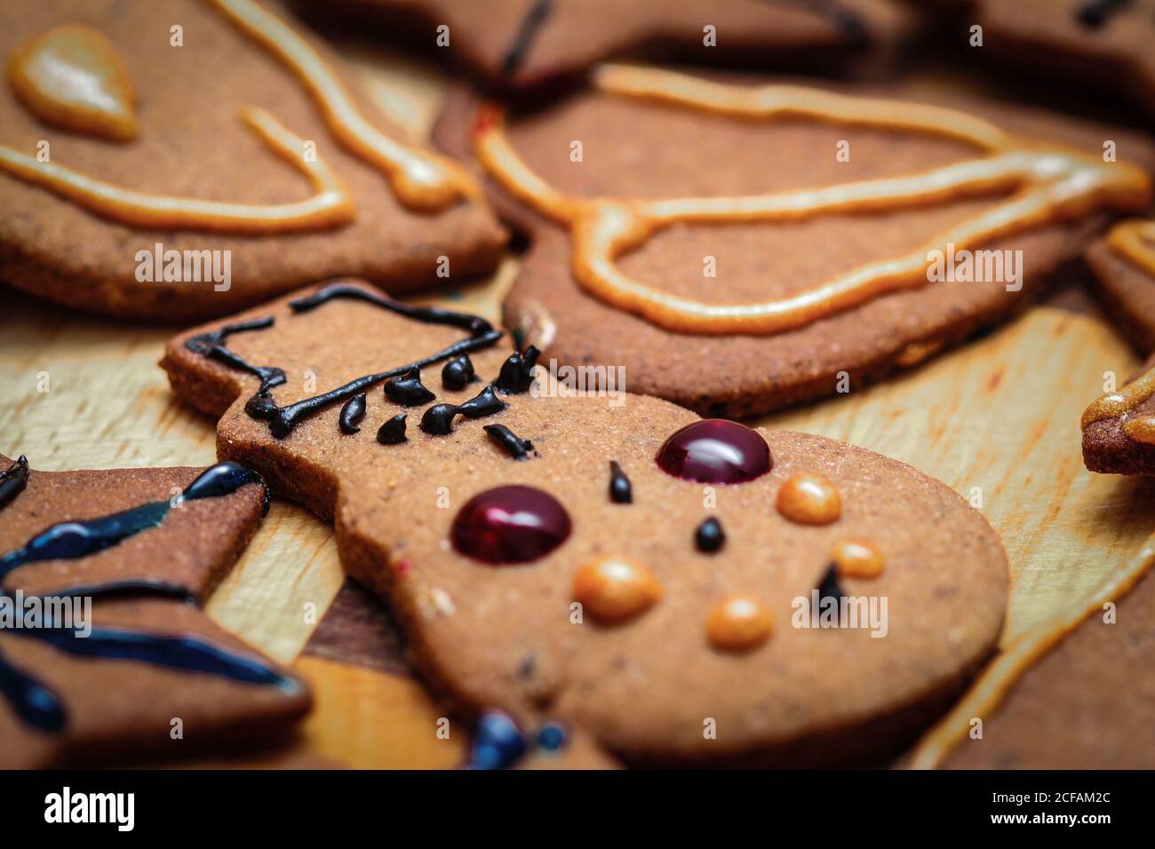 Closeup on children hand decorated christmas gingerbread cookie snowman figurine Stock Photo