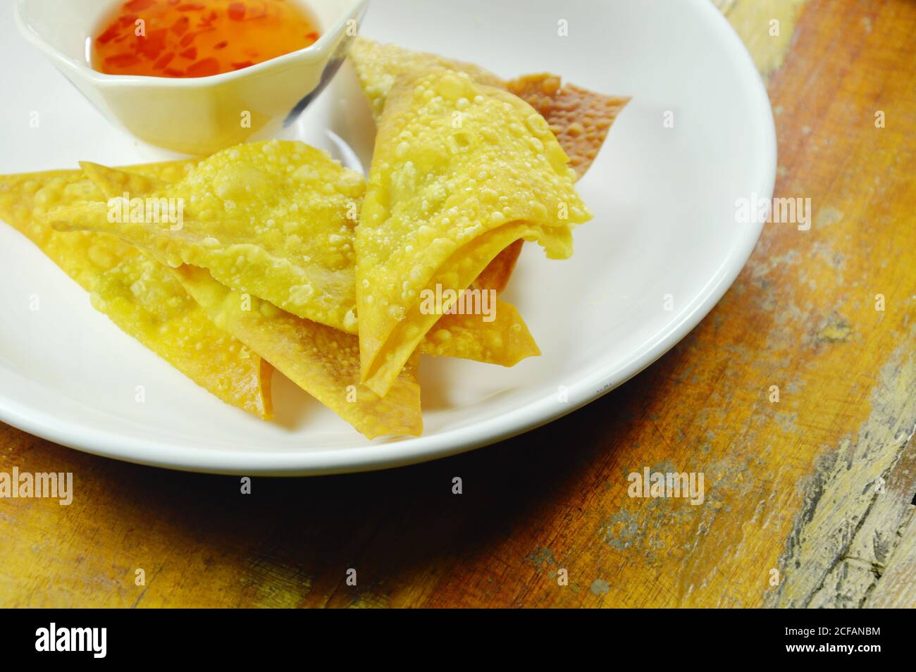 crispy fried dumpling paste dipping sweet chili sauce on plate Stock