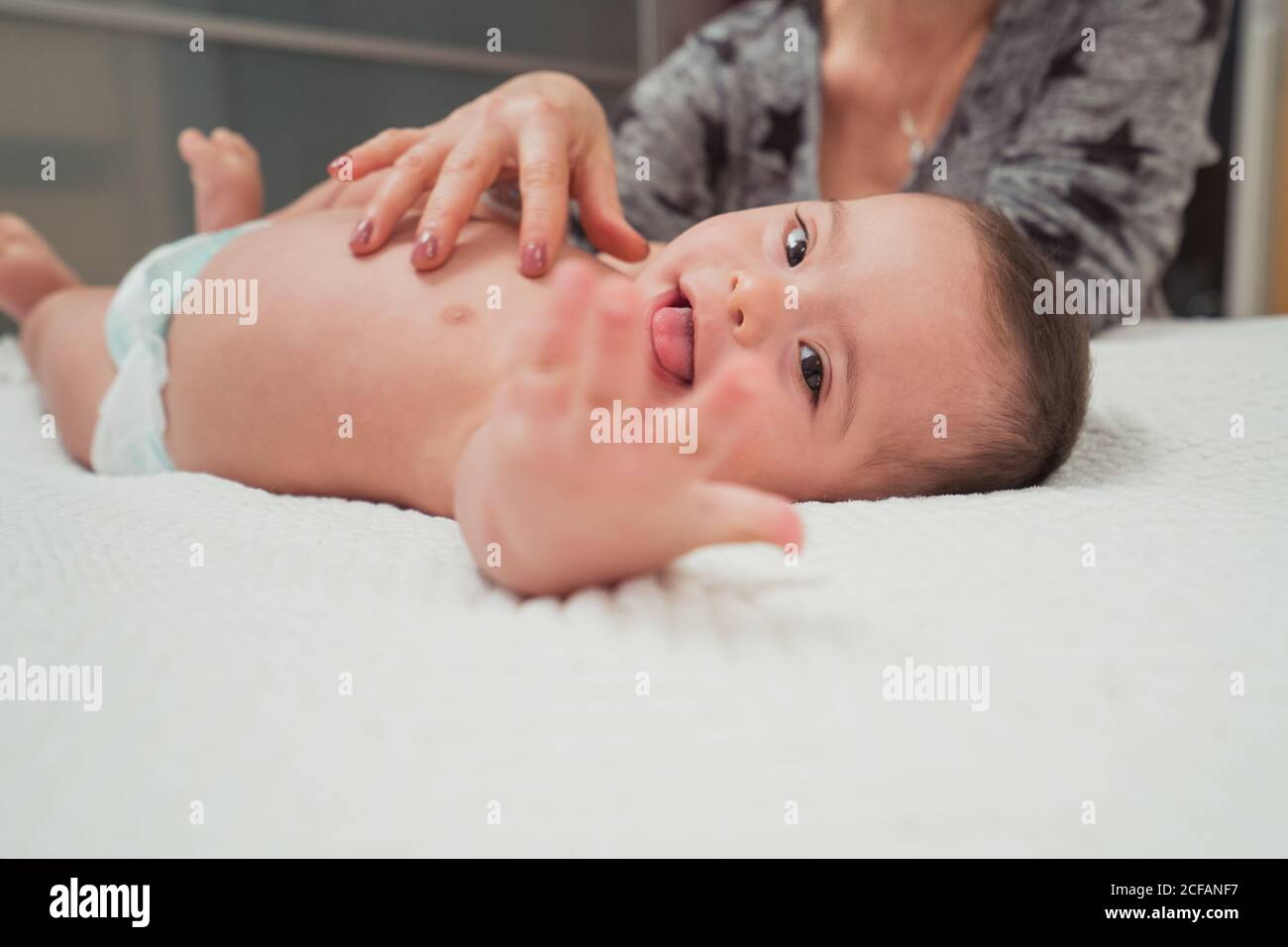 Portrait of cute baby boy with Down syndrome Stock Photo Alamy