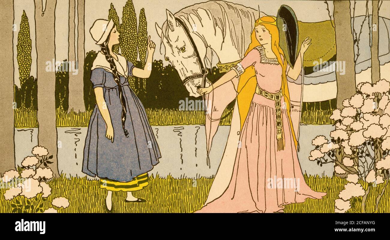 Princess holds the reins of a white horse and speaks to another young girl Stock Photo