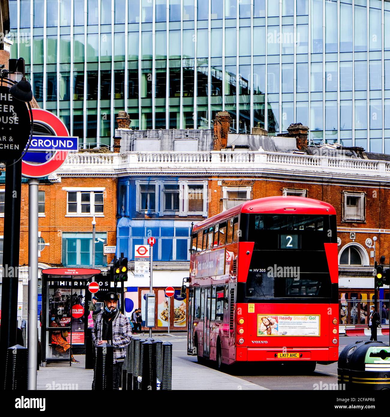 Red Double Decker Bus In Victoria London, UK Against Old And New Office Developments Stock Photo