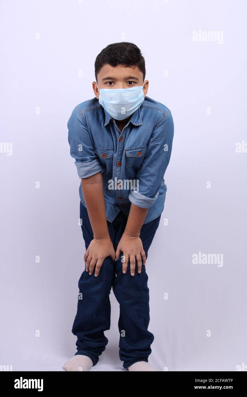 boy wearing mask isolated over white background. Stock Photo