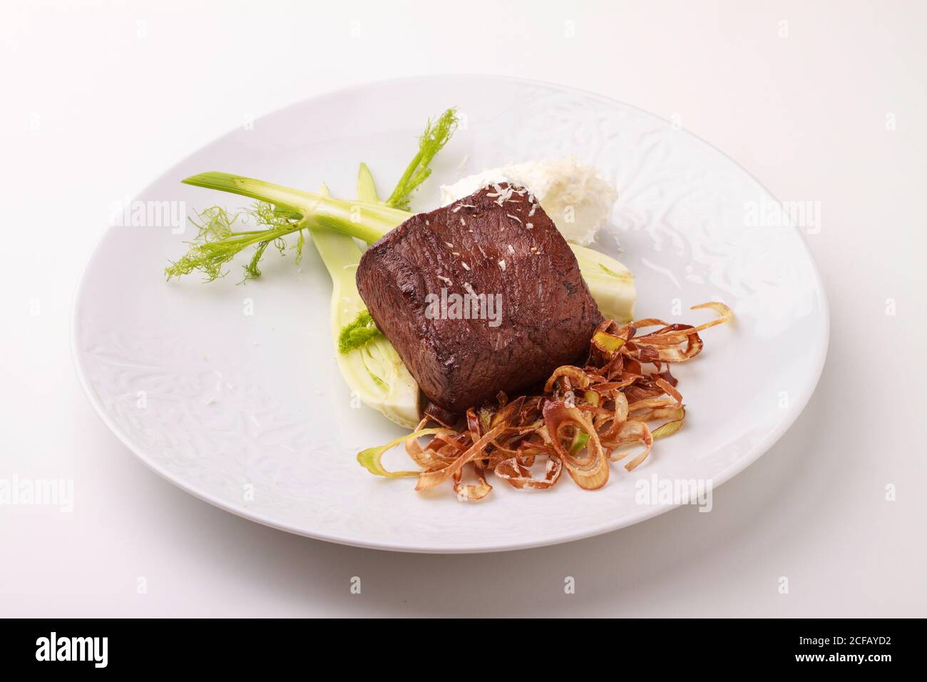 Venison fillet served with Leek slice, Fried Onion and Creamy