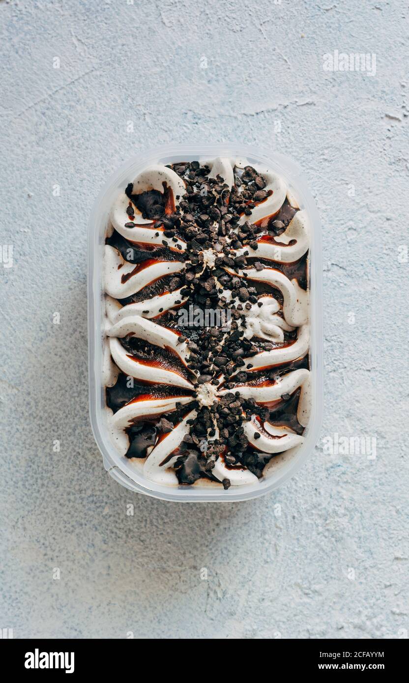 Tasty ice cream in plastic container Stock Photo Alamy