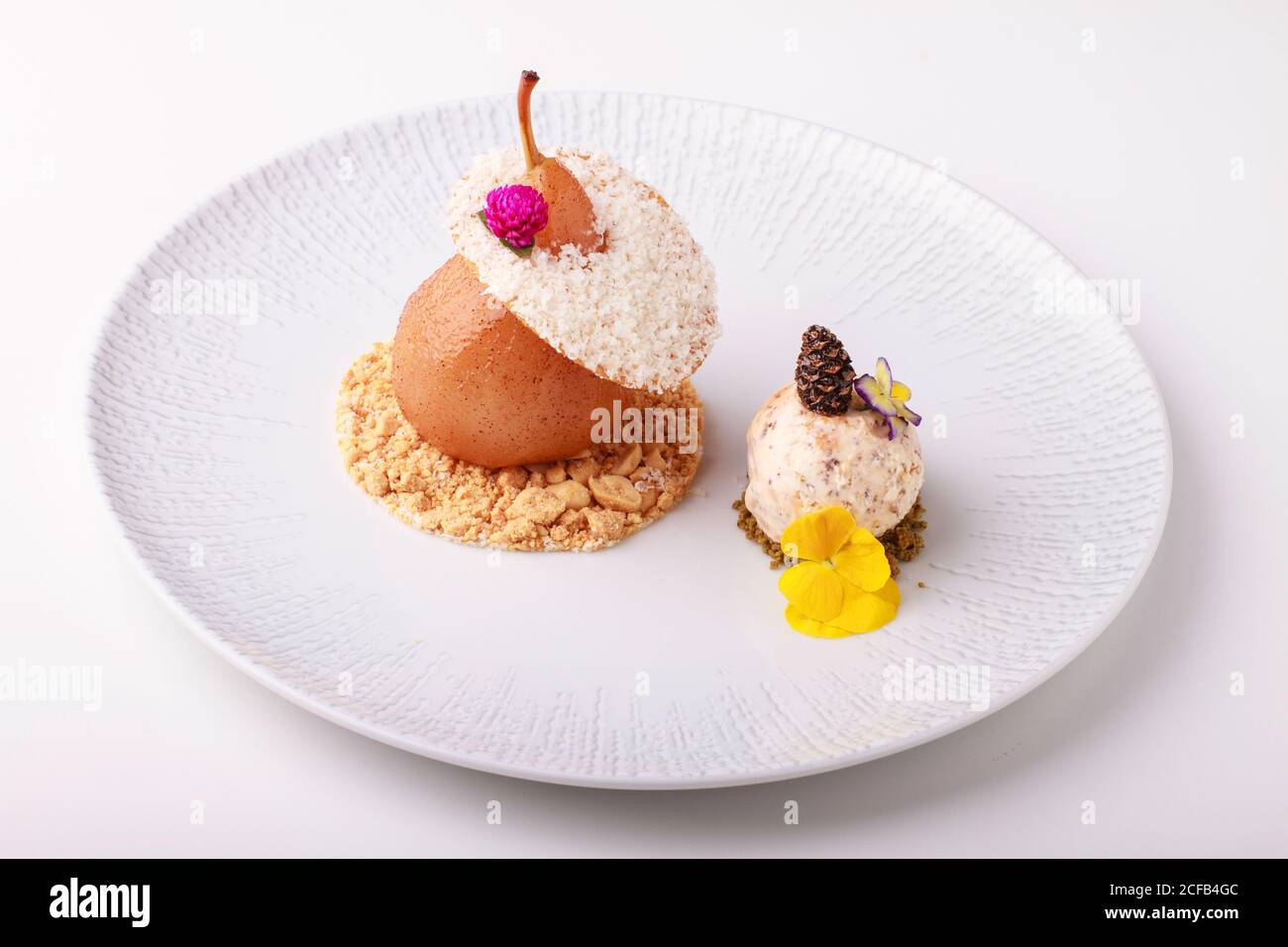 Poached Pear dessert with Praline and nut ice cream Stock Photo Alamy