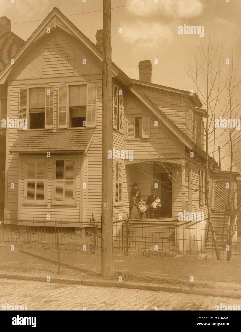 African American family posed on porch of house Stock Photo - Alamy