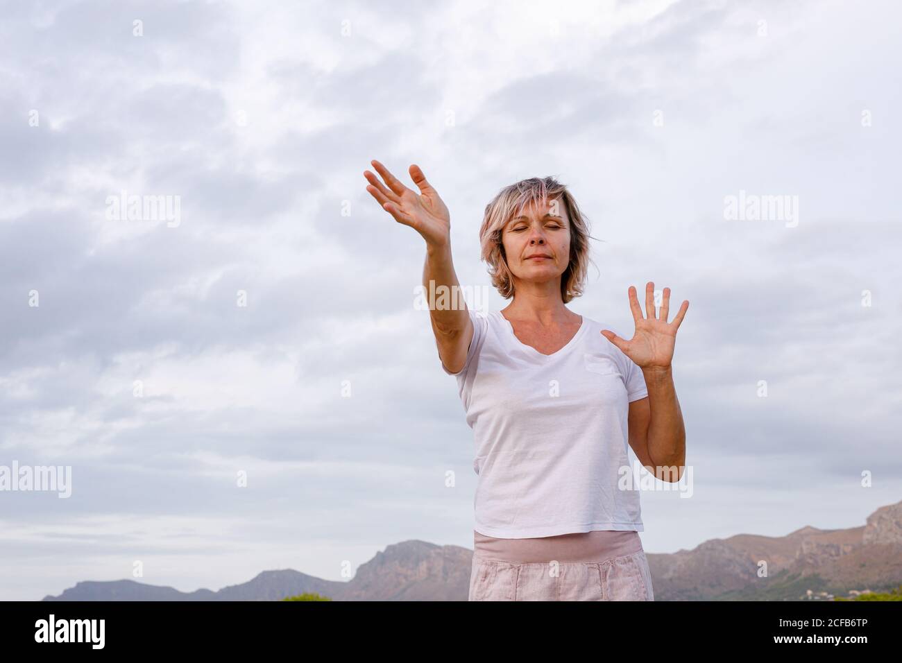 Adult Woman doing breathing exercise Stock Photo
