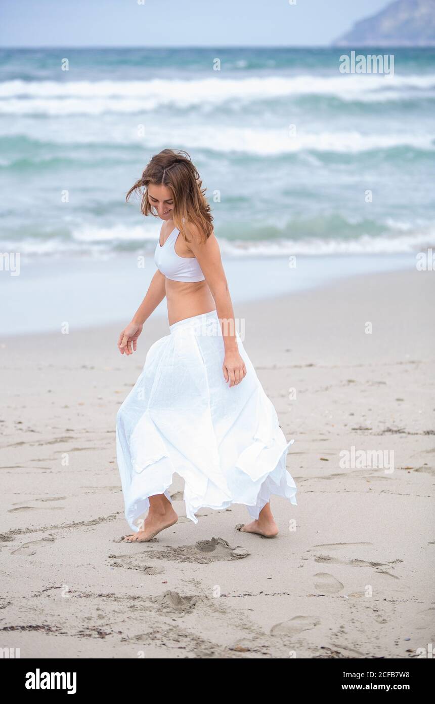 Woman dancing on shore near hi-res stock photography and images - Alamy