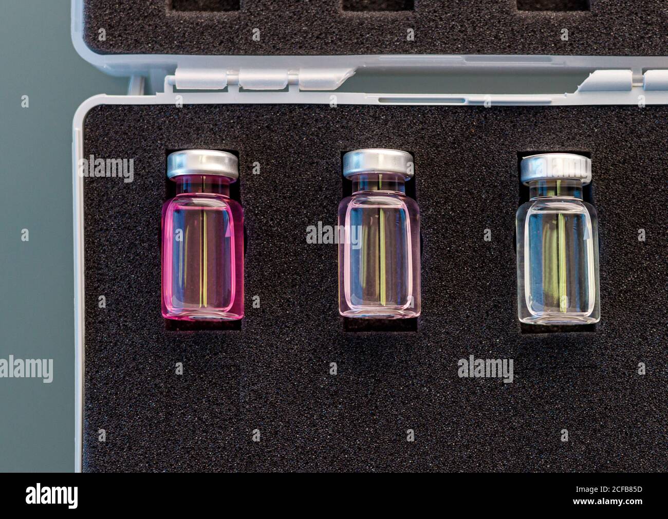 From above closed glass ampoules with scientific samples arranged in ...
