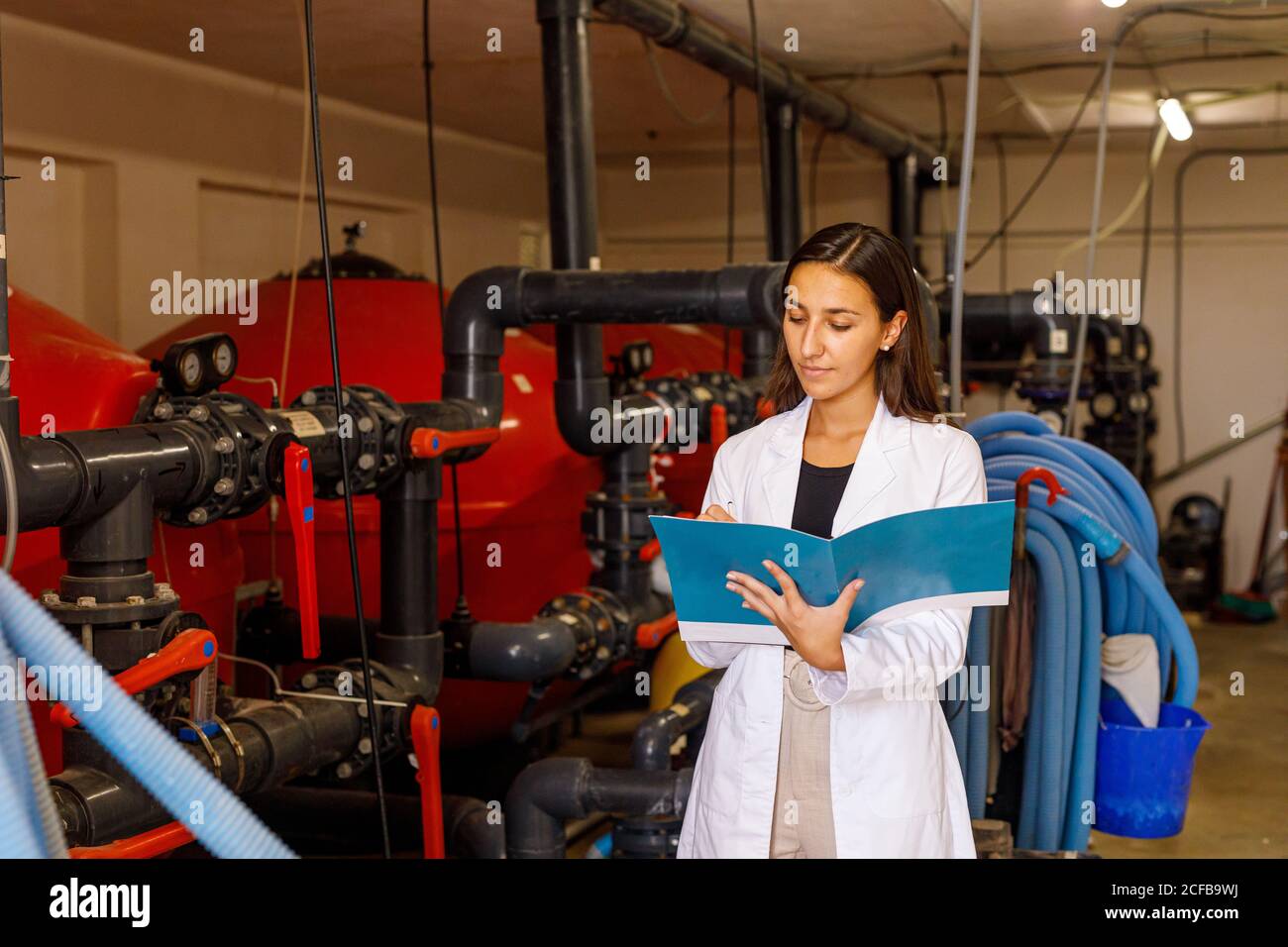 Safety inspector making notes in journal Stock Photo