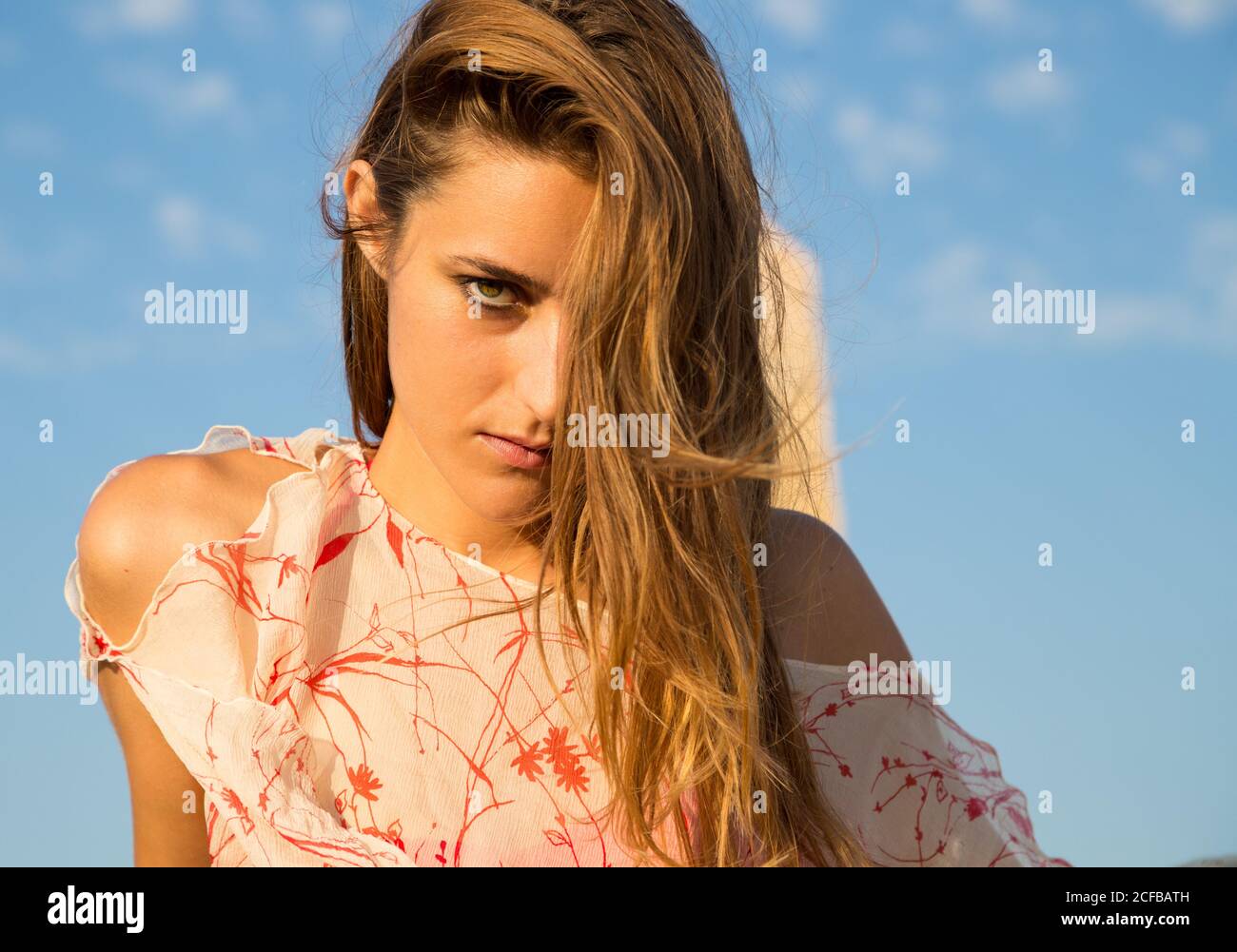 Woman in bikini posing near stone Stock Photo Alamy