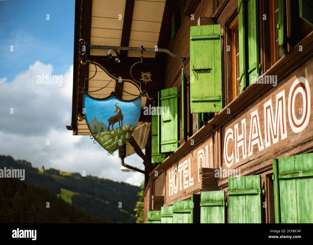 Regional style green window shutters, Switzerland Stock Photo