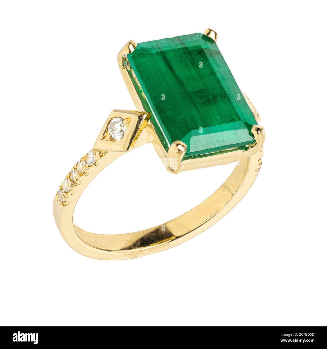Gold diamond and gemstone wedding ring closeup macro isolated on white background Stock Photo