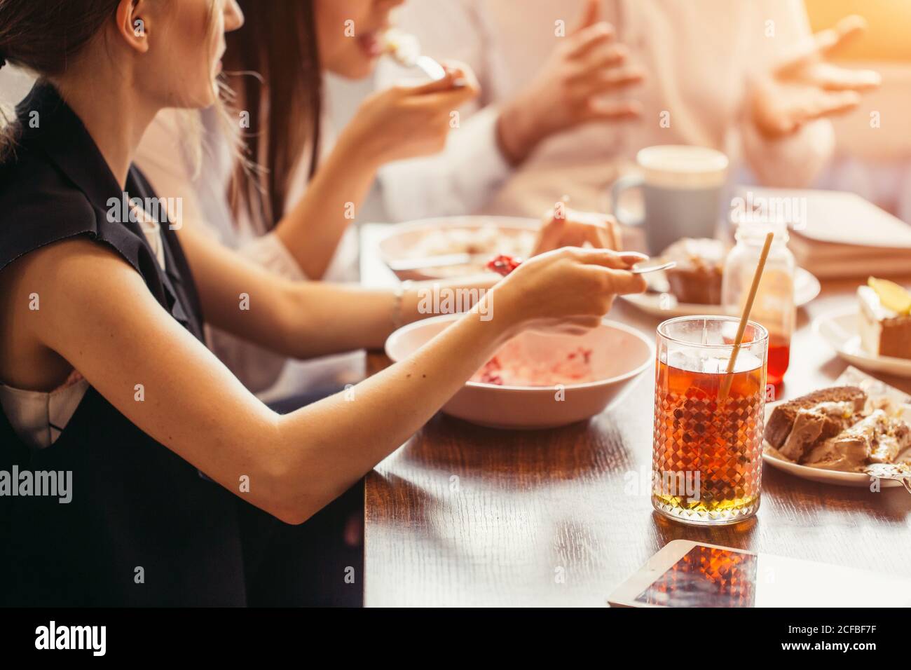 people, leisure and food concept close up friends having dinner and