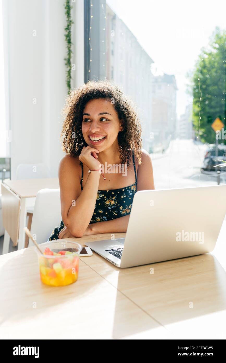 Woman using laptop in cafe Stock Photo